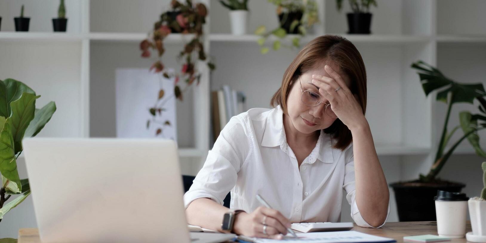 senior-woman-using-laptop-computer-and-serious-at-work-free-photo