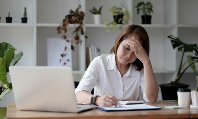senior-woman-using-laptop-computer-and-serious-at-work-free-photo